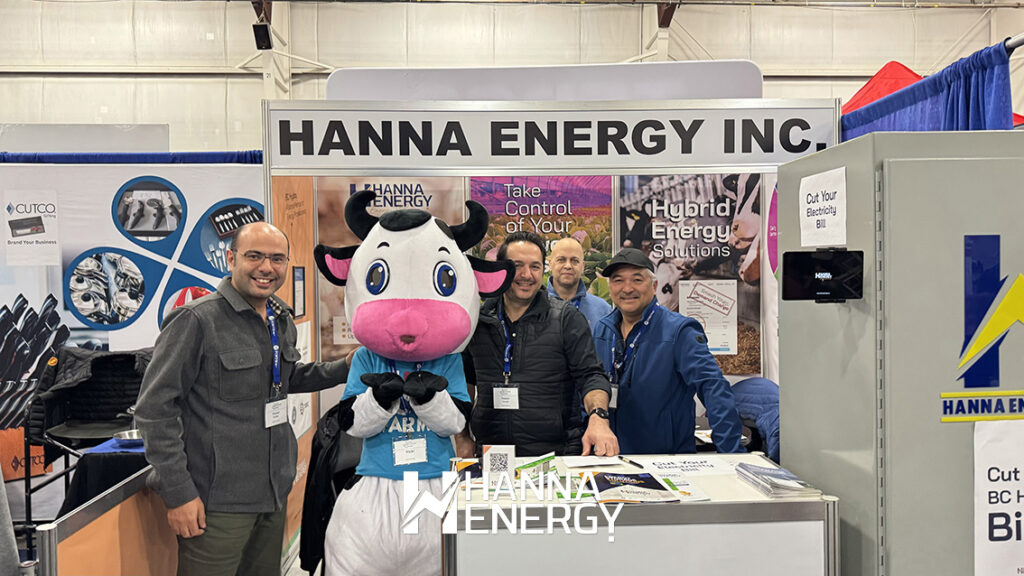 The Hanna Energy team, including Dr  Peyman Bordbar, poses with the Pacific Agriculture Show mascot at the company's booth during the 2026 Pacific Agriculture Show in Abbotsford, British Columbia 