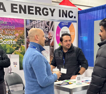 Visitors speak with the Hanna Energy team about battery energy storage and hybrid energy solutions at the company's booth during the 2026 Pacific Agriculture Show in Abbotsford, British Columbia 